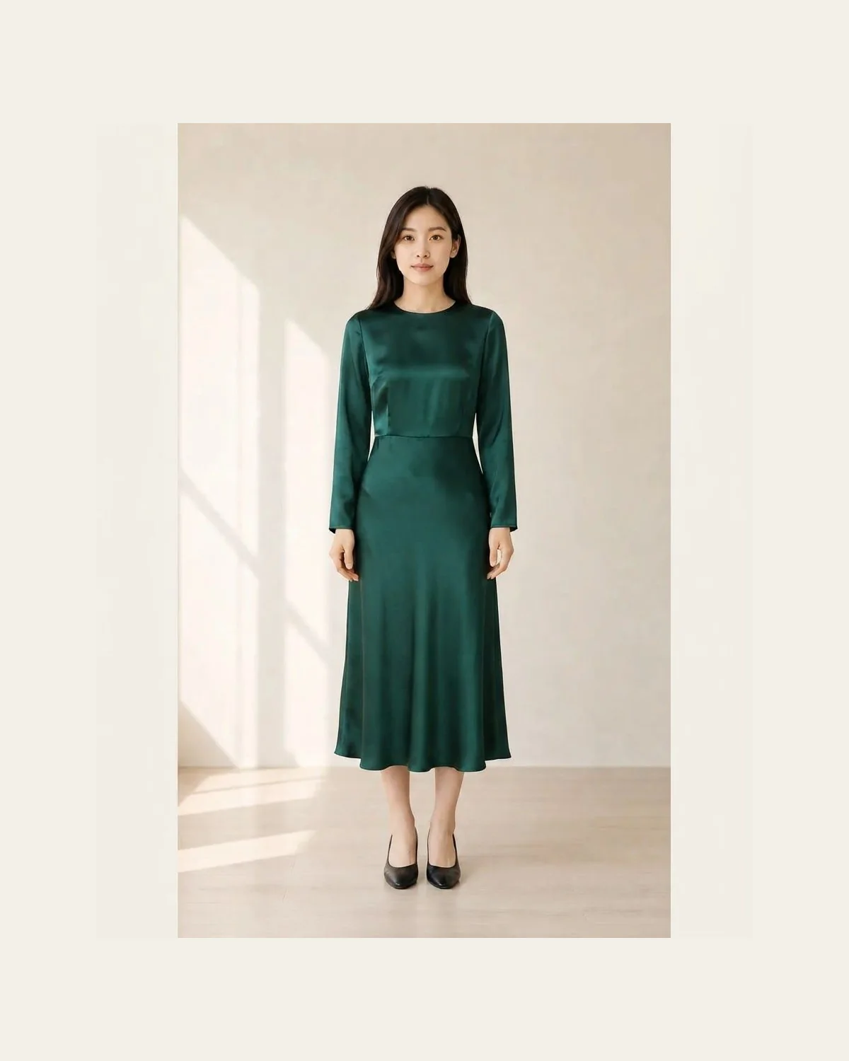 Emerald satin midi dress with simple black pumps